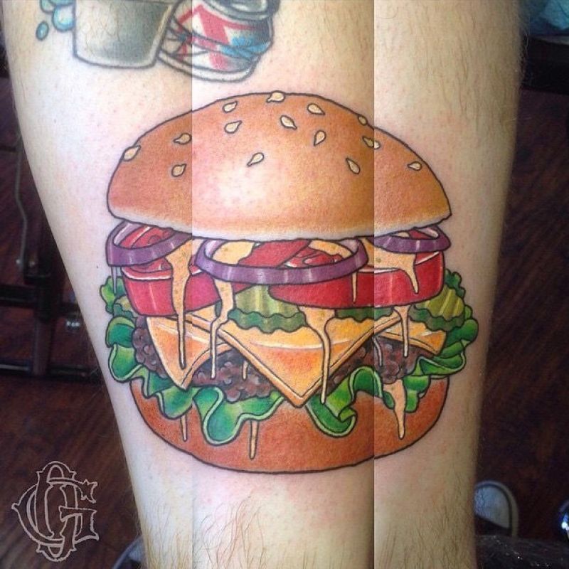 Donavan Tattoo - Cheeseburger tattoo with lettuce, tomato, pickles, onion on a sesame seed bun. 