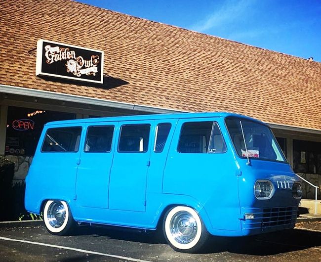 Golden Owl Tattoo Location with blue van out front