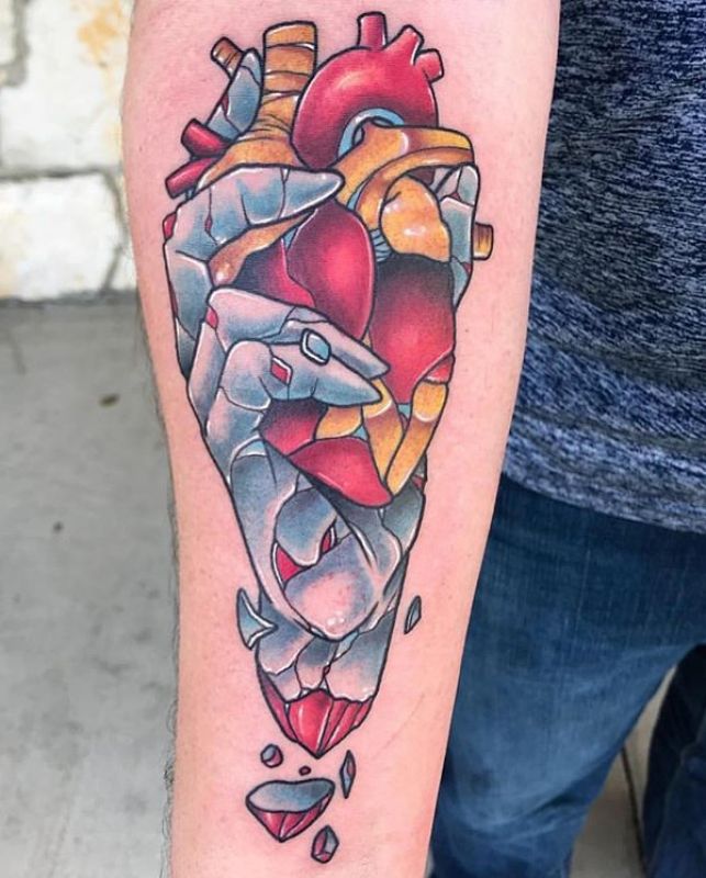 Donavan Tattoo - Hand of glass/ice gripping red/gold human heart